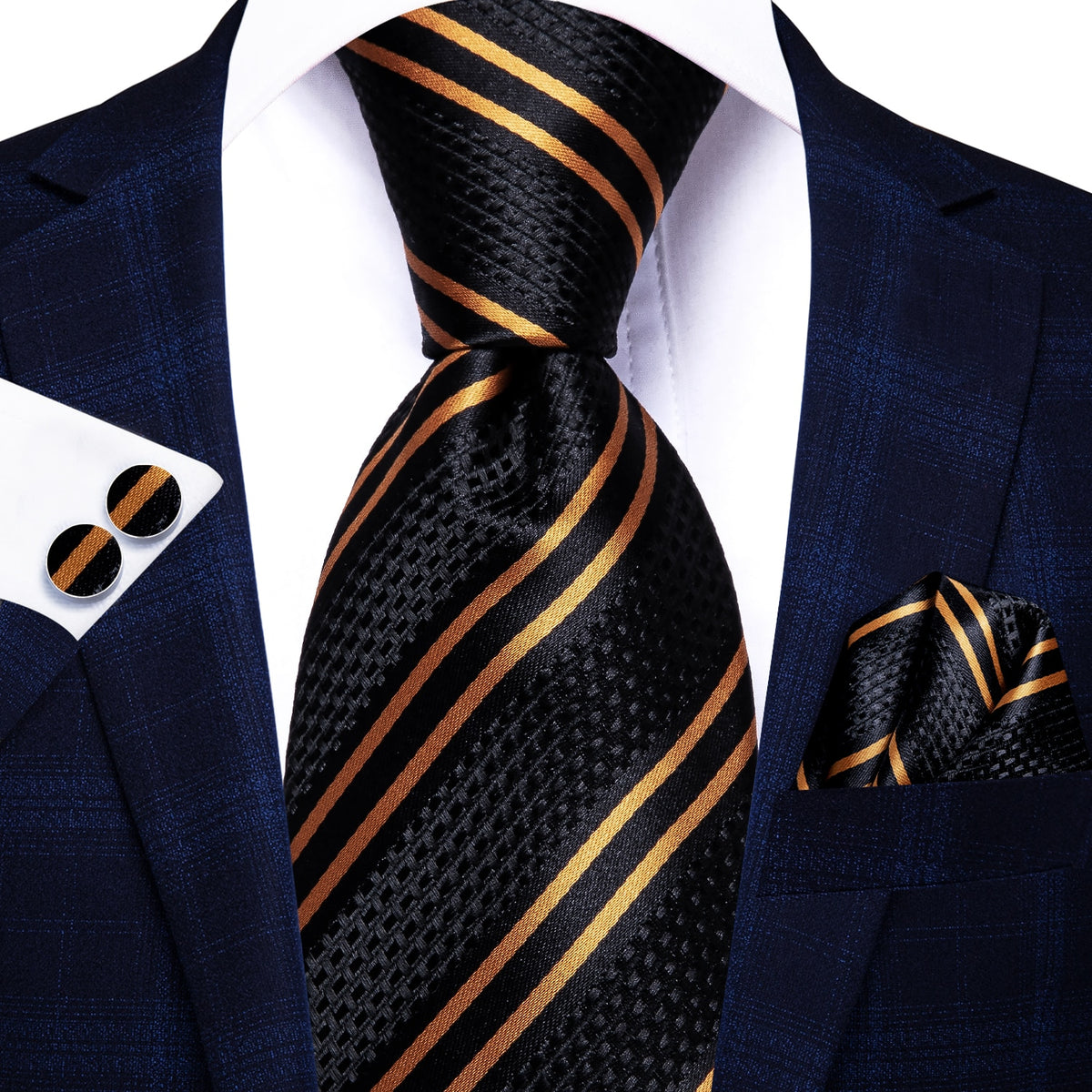 Three luxury men's accessories including a solid paisley silk tie, pocket square, and cufflinks for formal occasions.