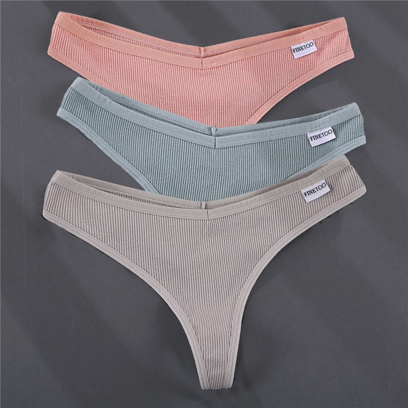 Three cotton G-string panties in solid colors, The Clothing Company Sydney lingerie, with smooth fabric and minimal coverage.