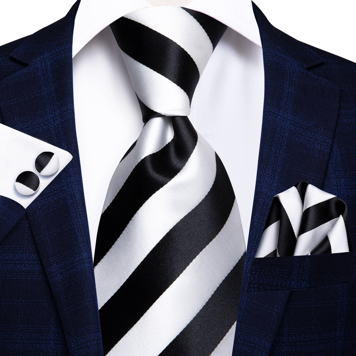 Set of three men's accessories including paisley silk necktie, pocket square, and cufflinks for formal and wedding attire.
