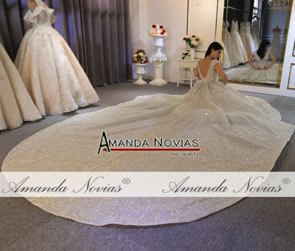 Elegant heavy beading luxury wedding dress by The Clothing Company Sydney, featuring intricate beadwork and a flowing bridal gown silhouette.