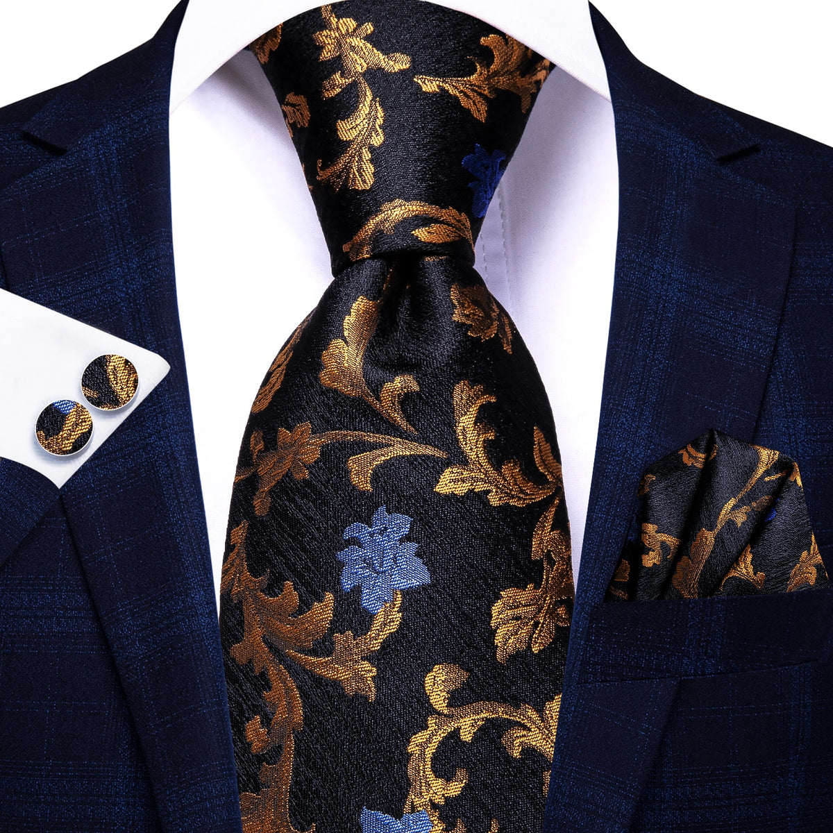 Three men's silk accessories including paisley necktie, pocket square, and cufflinks in formal luxury style.