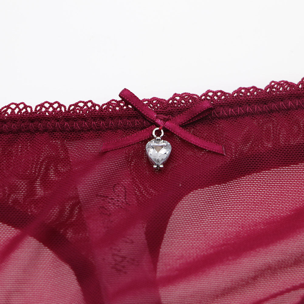 Ultra-thin transparent yarn lingerie set with bras, garters, thongs, and stockings by The Clothing Company Sydney, displayed on a model.