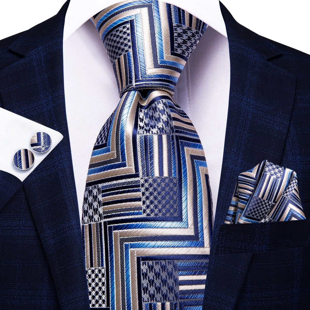 Three men's accessories including solid paisley silk neckties, cufflinks, and pocket square in elegant formal style.