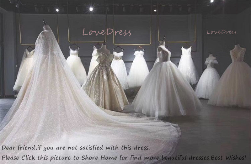 Elegant mermaid wedding dress with long sleeves, illusion back, lace appliqué, buttons, and a train from The Clothing Company Sydney.