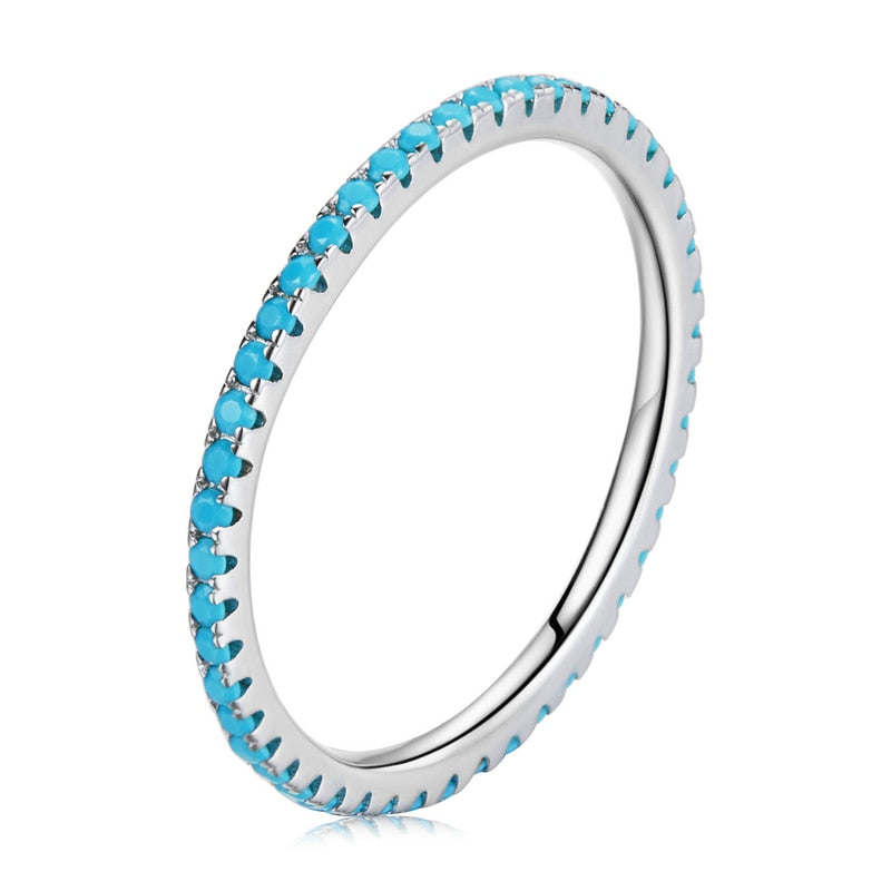 Sterling silver CZ simulated diamond stackable eternity ring with platinum plating, designed for women, displayed on a chain.