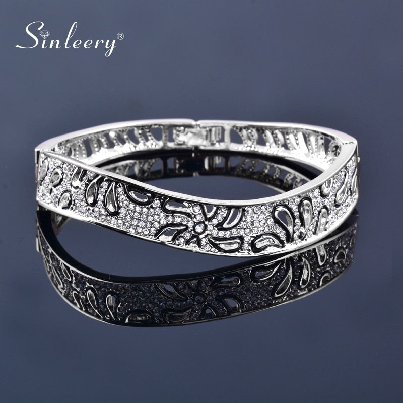 Rose gold and silver flower-shaped crystal bangle bracelet for women, elegant jewelry by The Clothing Company Sydney.