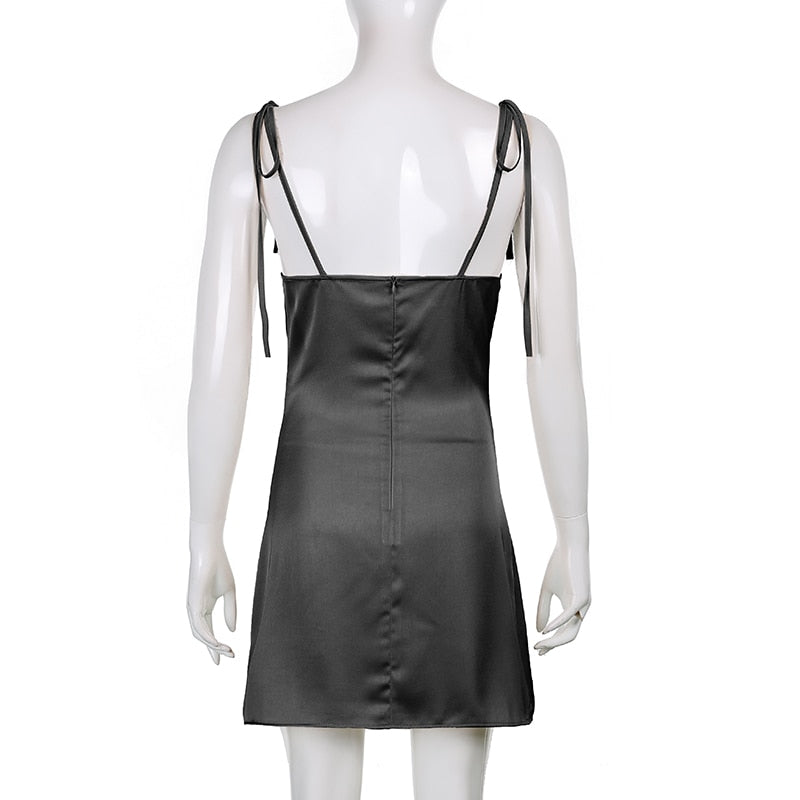 Black satin backless sleeveless mini sundress by The Clothing Company Sydney with strappy design for casual summer wear.