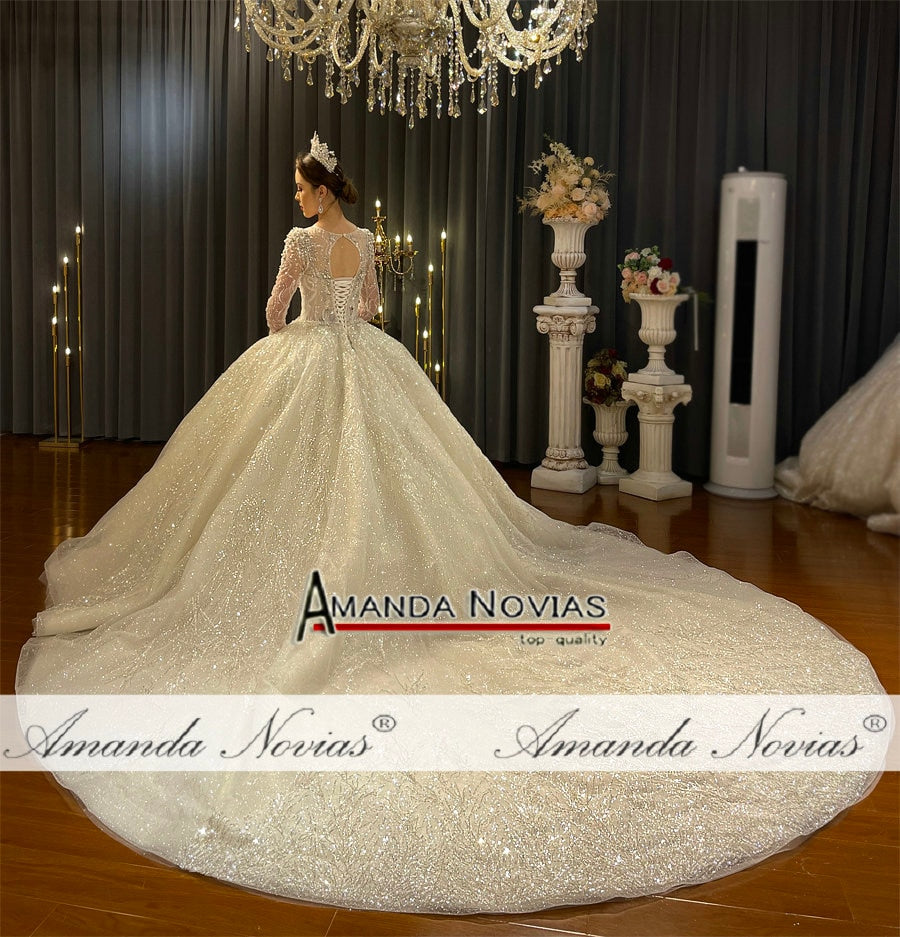 Elegant vintage luxury pearls beaded wedding bridal gown from The Clothing Company Sydney, featuring intricate pearl details and a flowing silhouette.