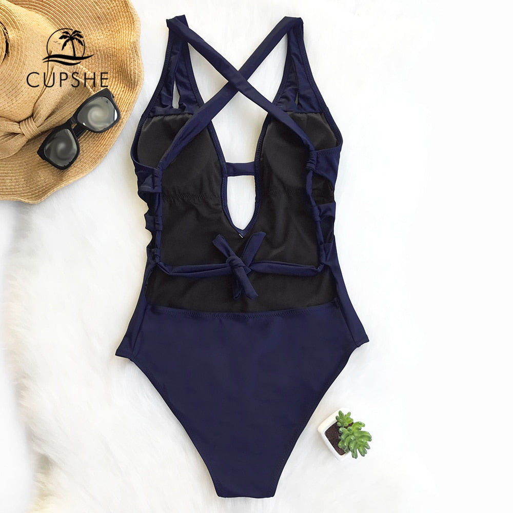 Solid dark blue one-piece swimsuit by The Clothing Company Sydney featuring a deep V-neck, backless X-back design and swimwear style.