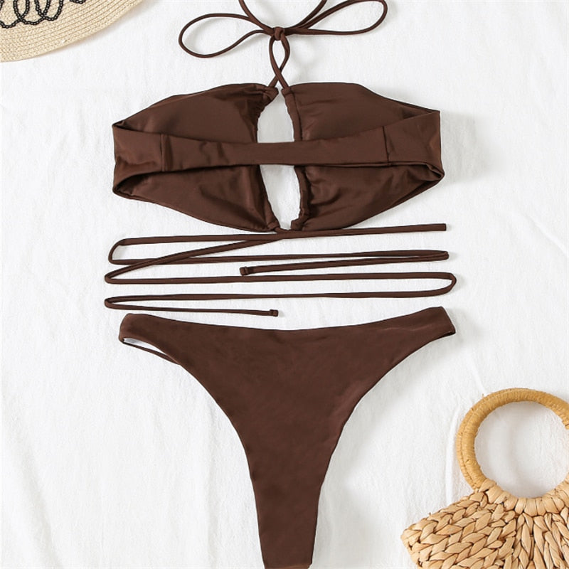 Drawstring bandage bikini set by The Clothing Company Sydney, featuring a solid halter swimsuit with adjustable ties for beachwear.