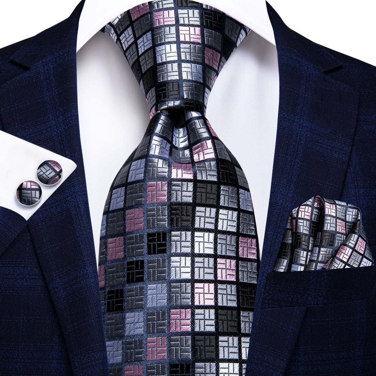 Three silk men's accessories including solid paisley neckties, cufflinks, and pocket square for formal and wedding attire.
