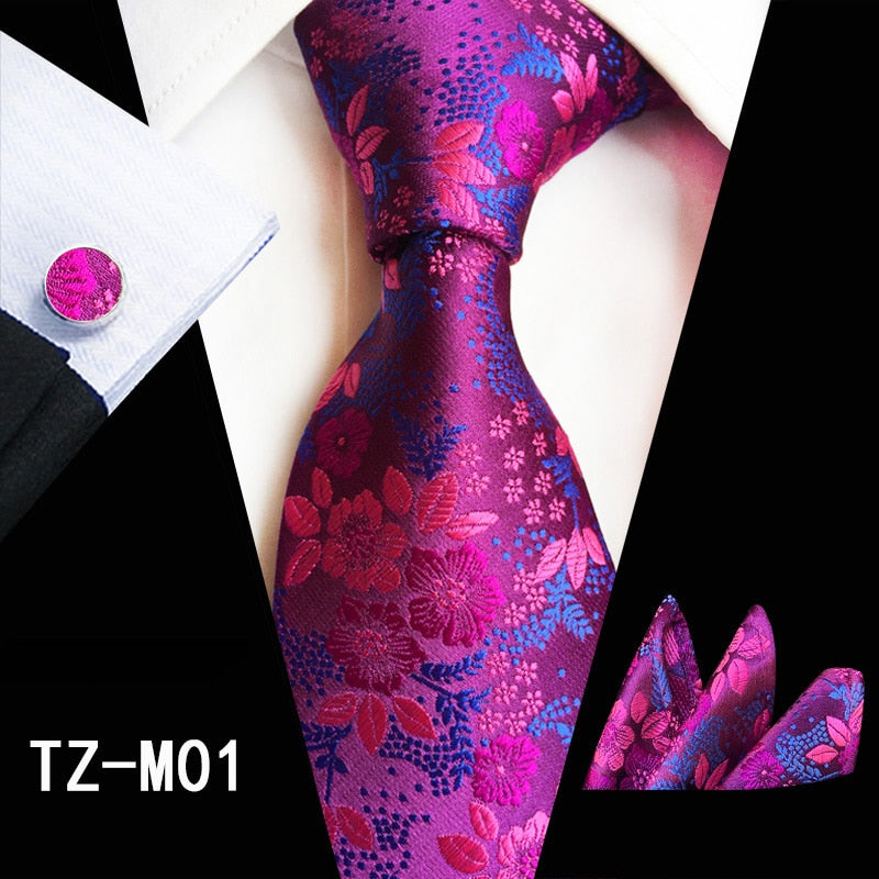 Red and green floral silk tie set with matching handkerchief, cufflinks, and necktie for men's business and wedding accessories.
