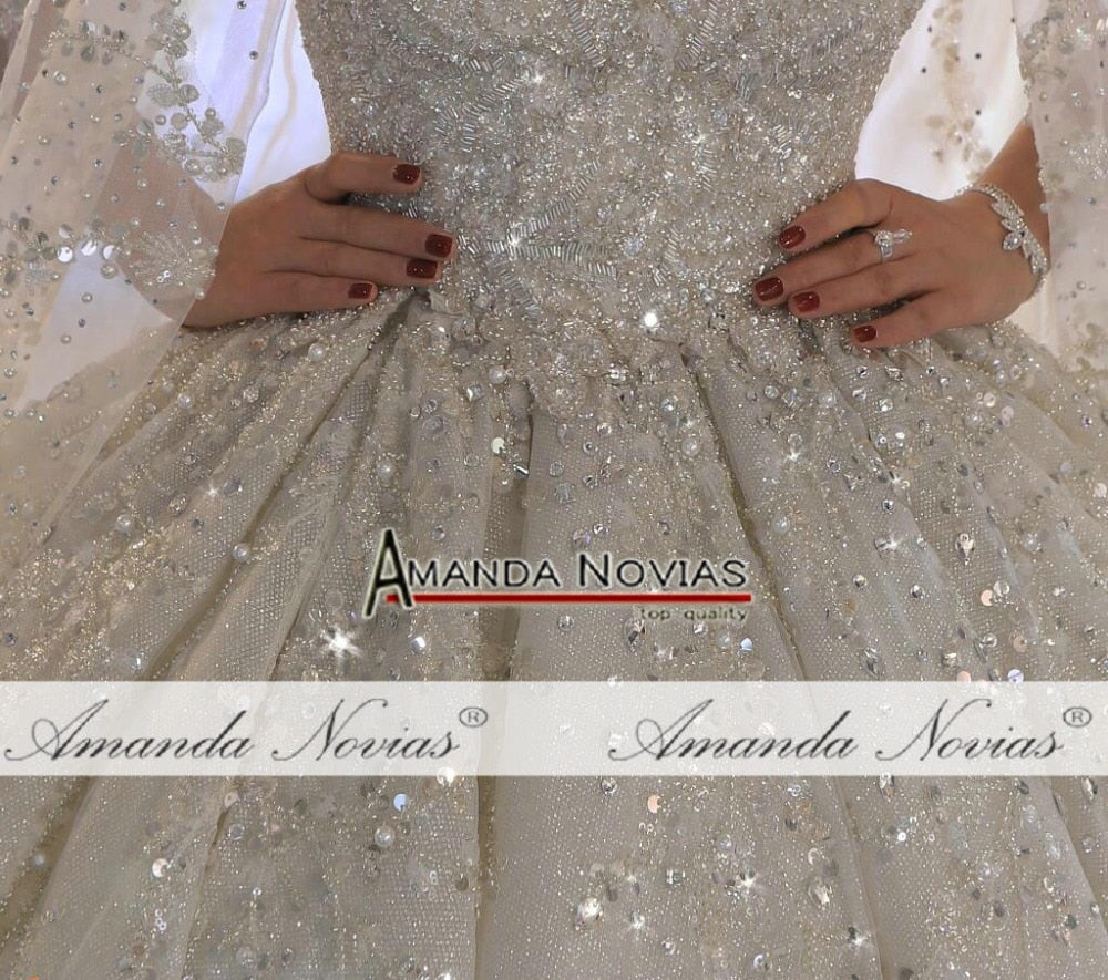 Luxury wedding gown with heavy beading, elegant bridal dress by The Clothing Company Sydney, featuring intricate beadwork and a flowing silhouette.
