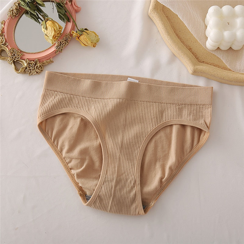 Two seamless women thong panties from The Clothing Company Sydney, made of soft cotton blend, featuring comfortable bikini-style design.