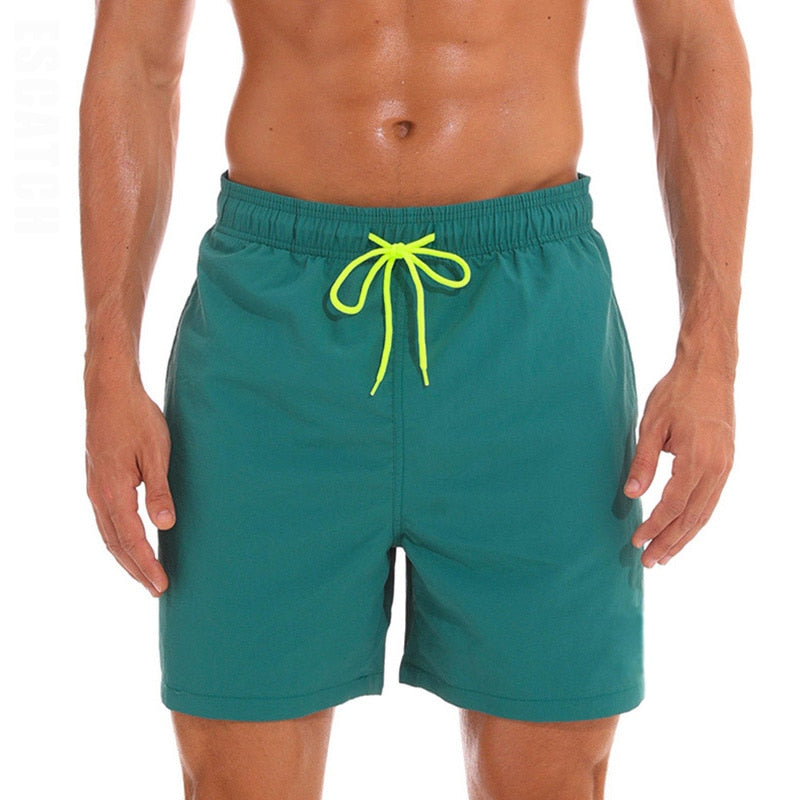 Men's swim shorts by The Clothing Company Sydney featuring lightweight fabric, adjustable waistband, and vibrant beach-inspired design.