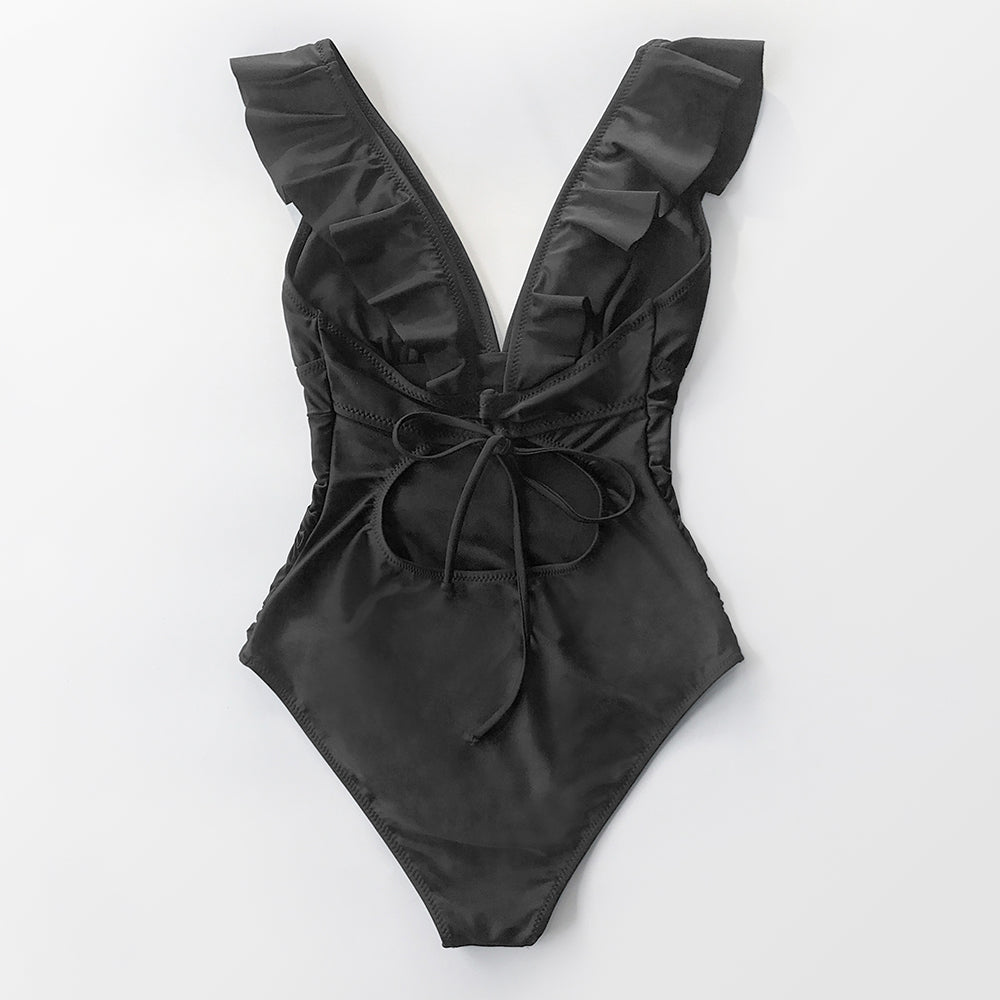 Solid black ruffled one-piece swimsuit with lace-up front, featuring a monokini style from The Clothing Company Sydney.
