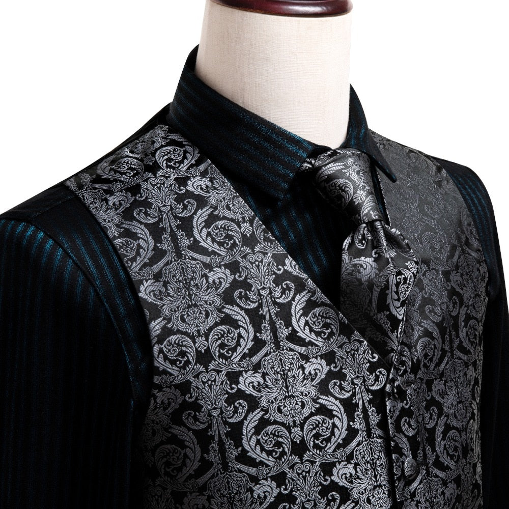 Men's luxury vest and tie set featuring paisley, floral, and plaid silk design in blue, gold, red, and silver for wedding attire.
