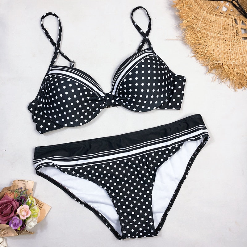 Black polka dot bikini from The Clothing Company Sydney featuring padded push-up swimsuit top and matching bottoms.