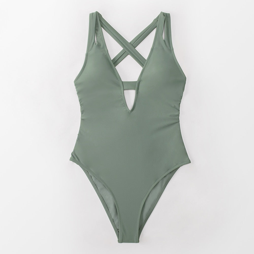 Dark blue one-piece swimsuit by The Clothing Company Sydney featuring a deep V-neck, backless design, and X-back swimwear style.