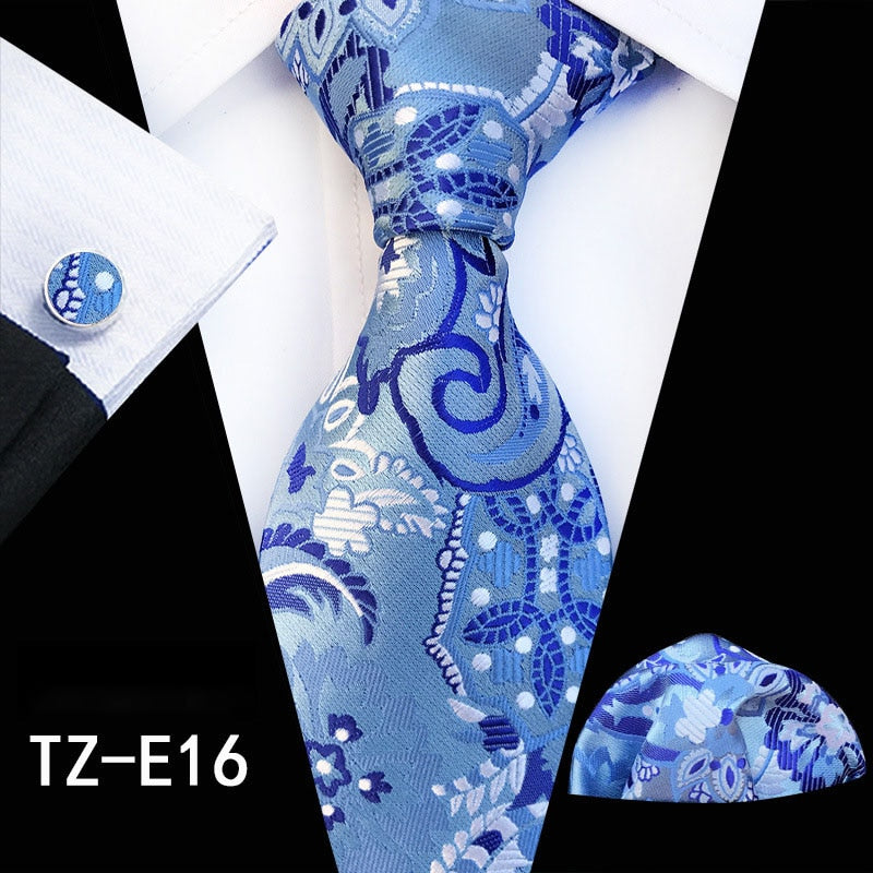 Red and green floral silk tie set with matching handkerchief and cufflinks for men's business and wedding accessories.