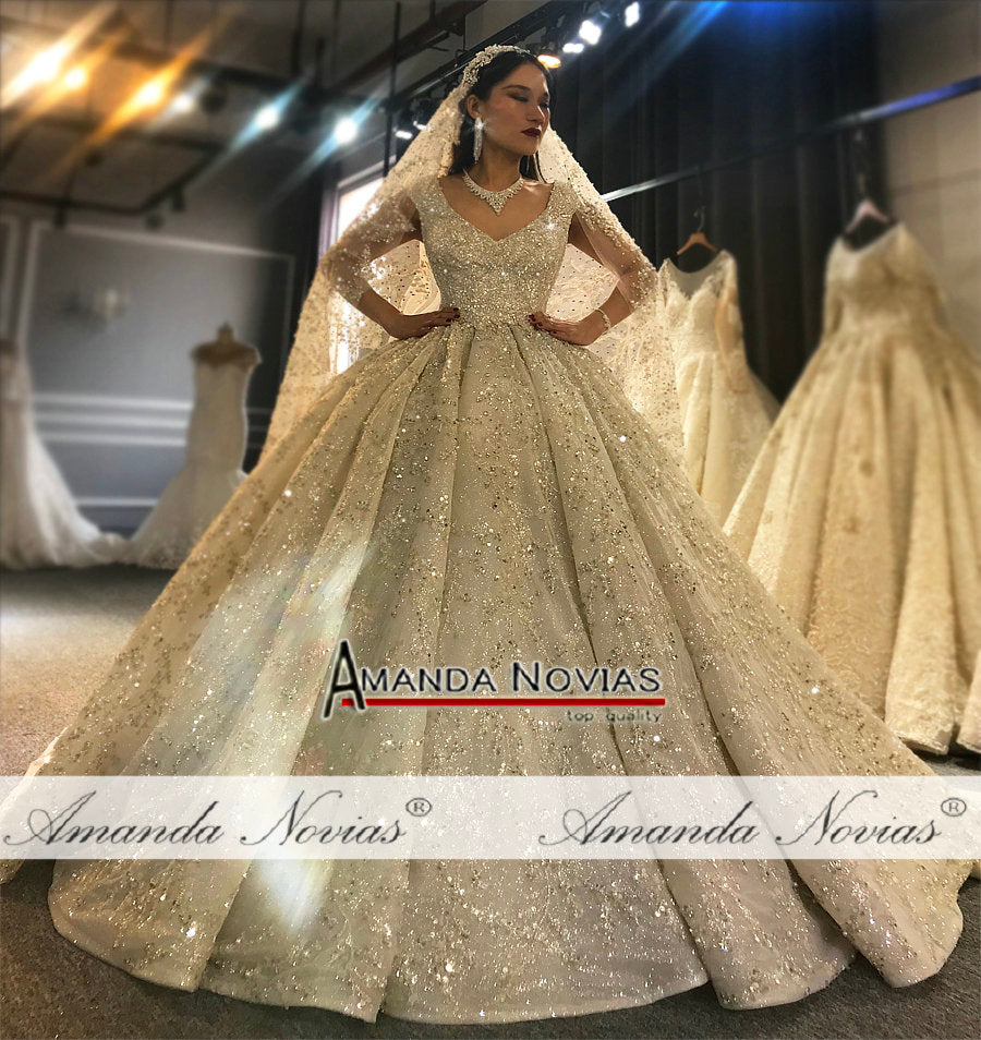 Elegant heavy beaded luxury wedding dress by The Clothing Company Sydney featuring intricate beadwork and a classic bridal gown silhouette.