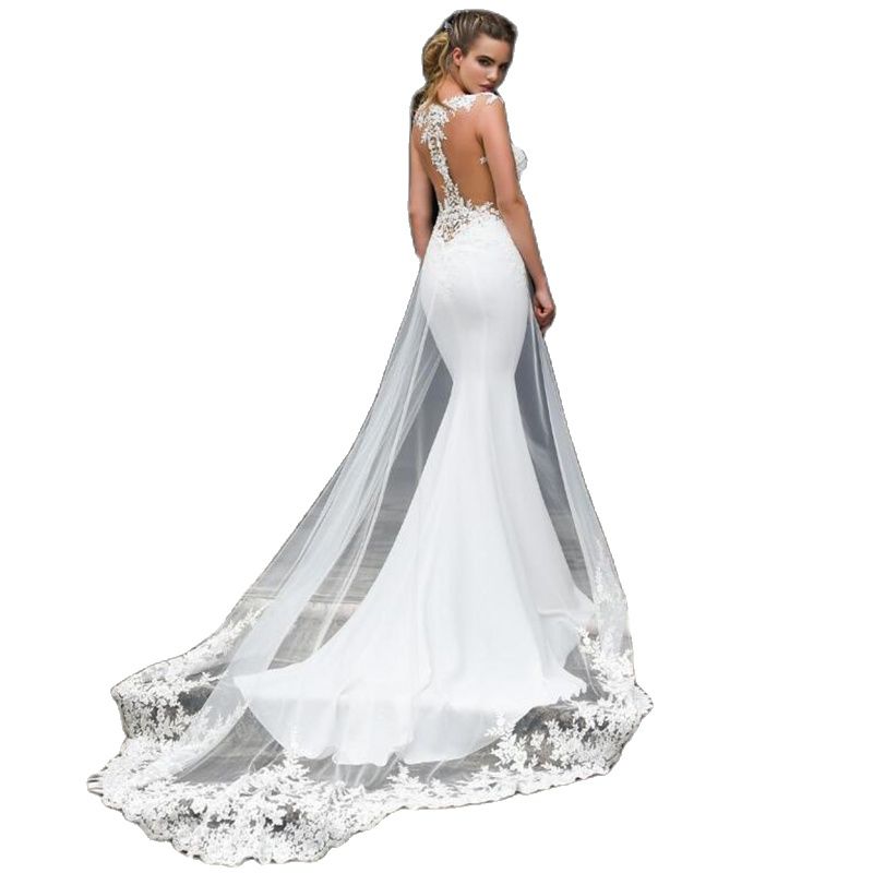 Elegant sleeveless mermaid wedding dress by The Clothing Company Sydney with lace appliques and a see-through back for brides.