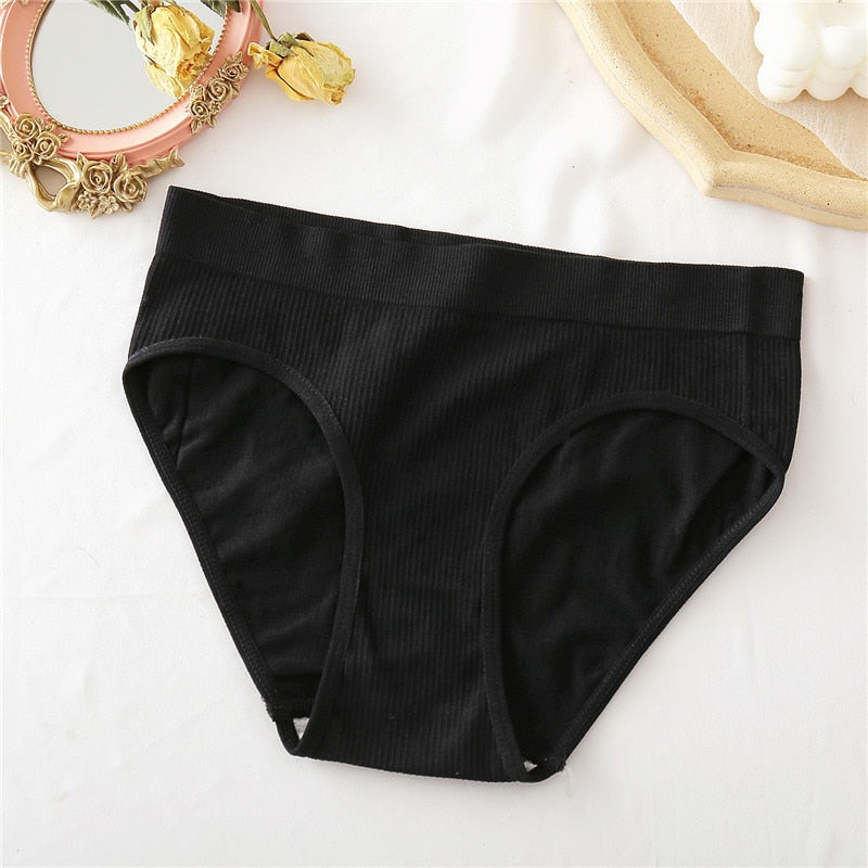 Two seamless women's thong panties by The Clothing Company Sydney, made of comfortable cotton blend, shown on a neutral background.