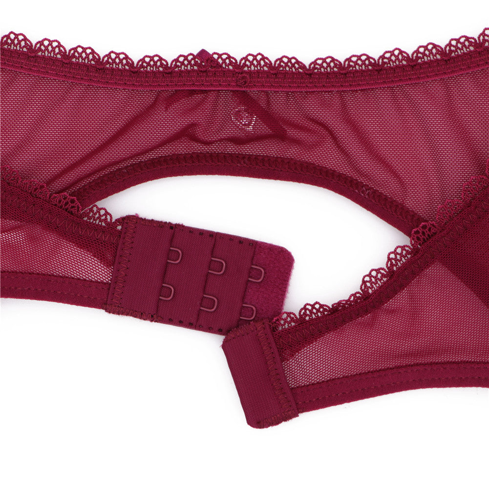 Ultra-thin transparent yarn lingerie set with bras, garters, thongs, and stockings by The Clothing Company Sydney displayed on a model.