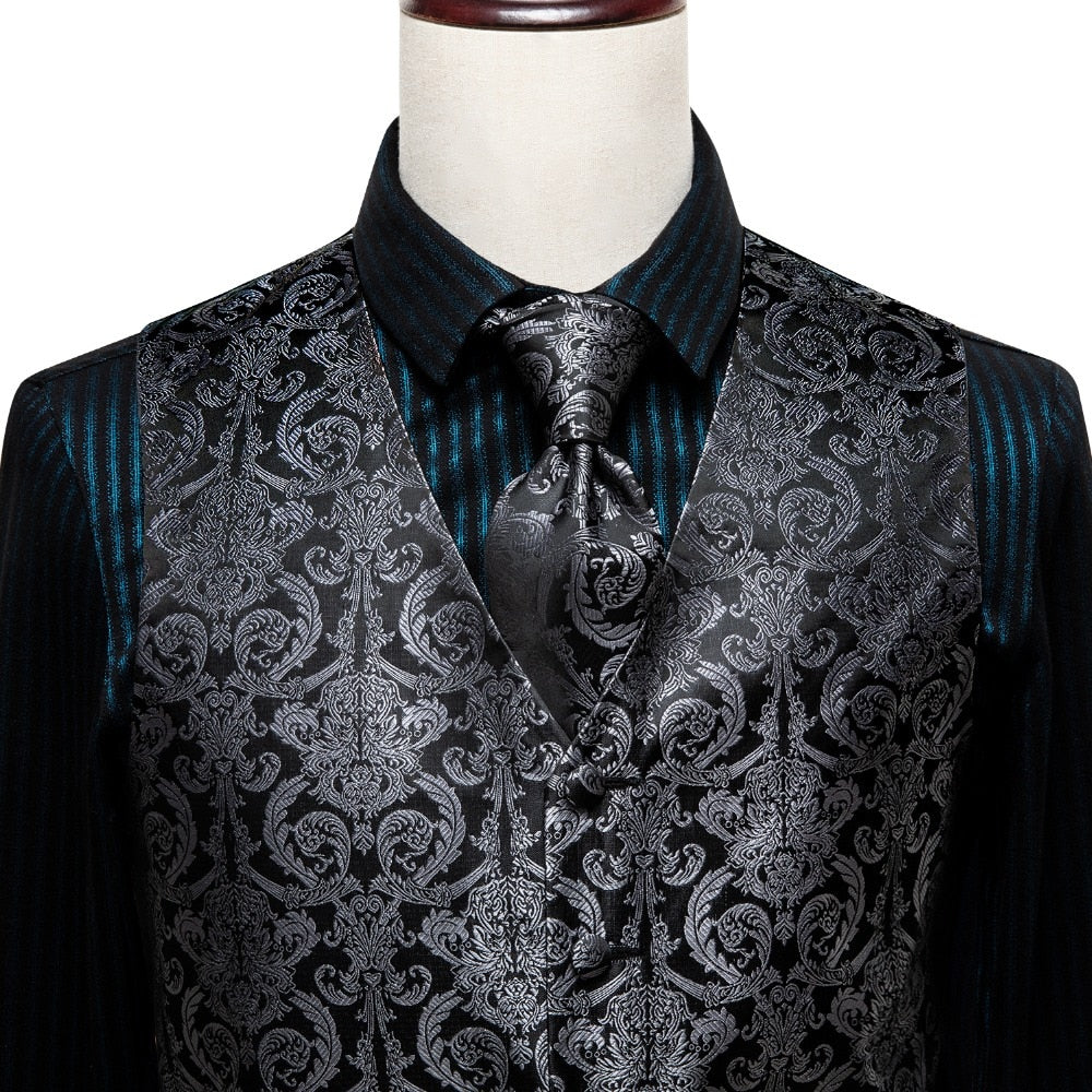 Luxury men's vest and tie set featuring paisley, floral, and plaid patterns in blue, gold, red, and silver, perfect for formal events.