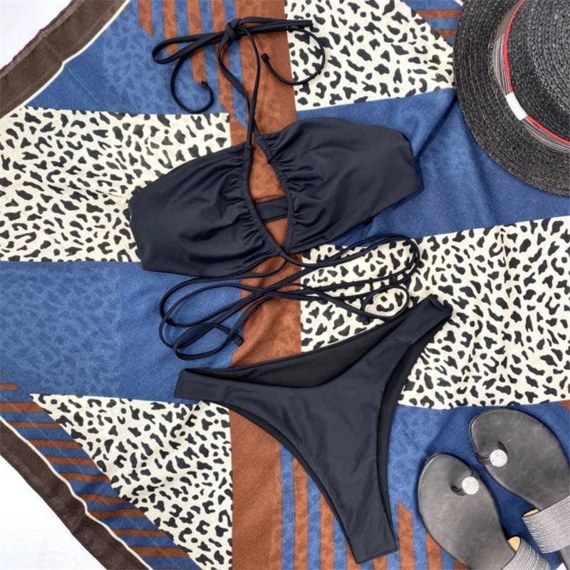 Drawstring bandage bikini set by The Clothing Company Sydney featuring a halter top and solid two-piece swimsuit for beachwear.