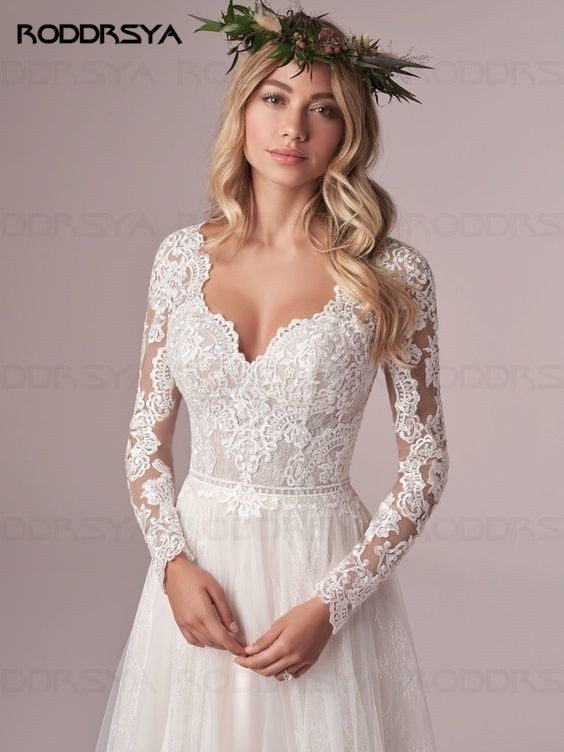 Ivory A-line long sleeves wedding dress with lace, tulle fabric, open back, by The Clothing Company Sydney.