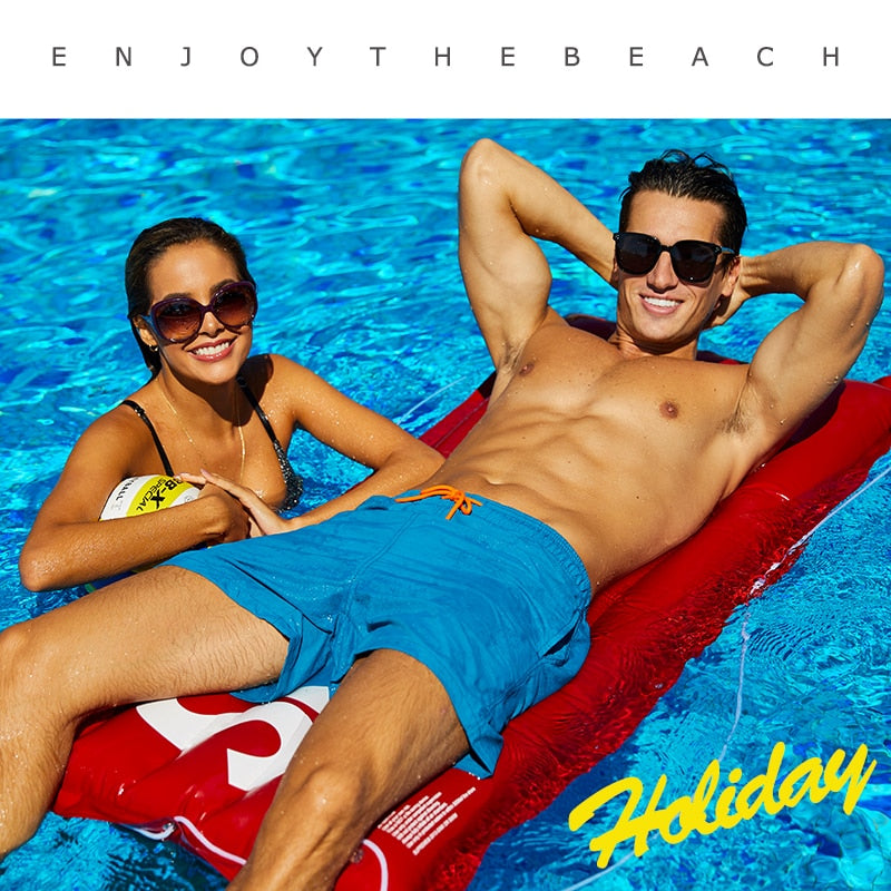 Men's swim shorts by The Clothing Company Sydney, beach and surf trunks with a vibrant pattern, suitable for swimming and beach sports.