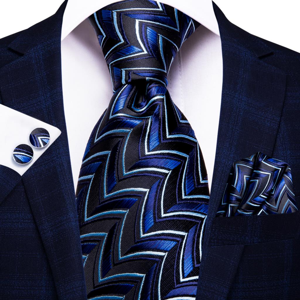 Blue silk men's business tie with dot pattern, plaid cufflinks, and accessories for wedding or formal attire.