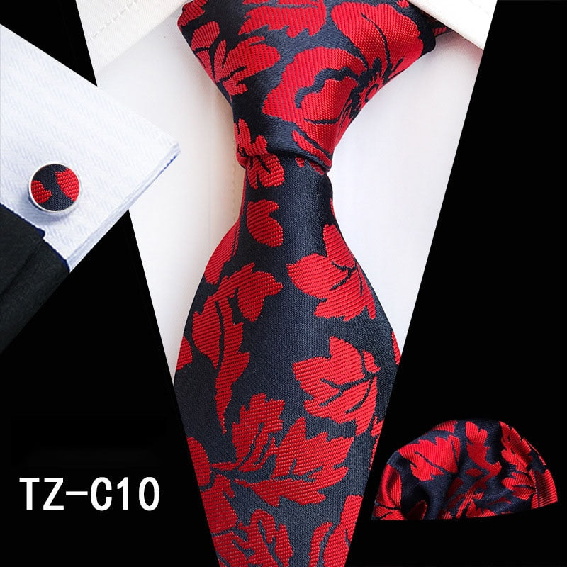 Red and green floral men's silk tie set with matching handkerchief, cufflinks, and necktie by The Clothing Company Sydney.