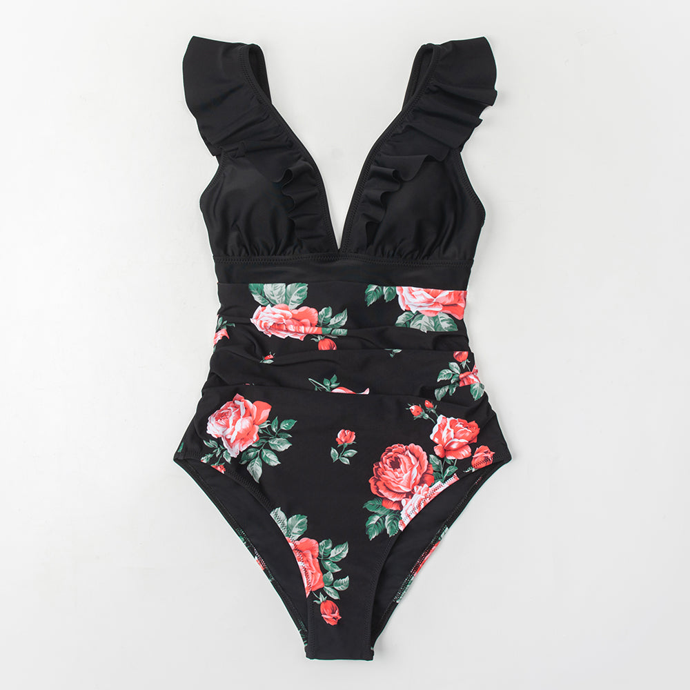 Solid black ruffled one-piece swimsuit by The Clothing Company Sydney featuring lace-up front and stylish beach-ready design.