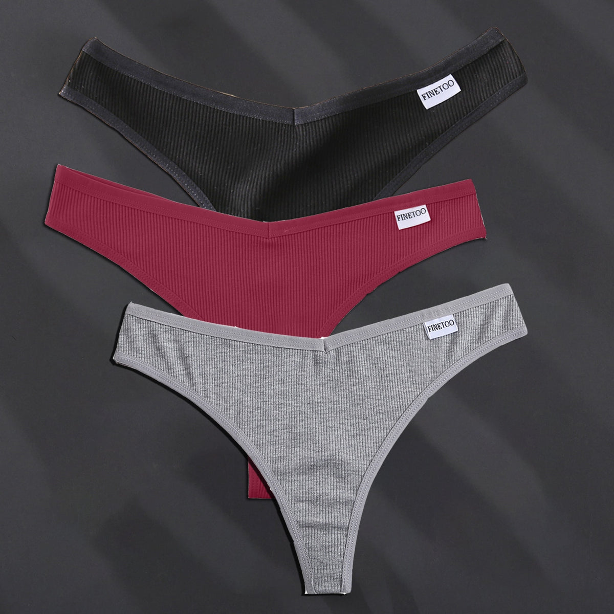 Three cotton G-string panties from The Clothing Company Sydney in solid colors, showcasing comfortable lingerie and thong briefs.