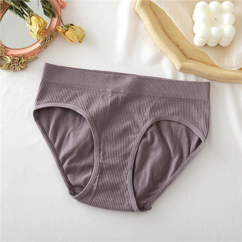 Two seamless women's thong panties by The Clothing Company Sydney in cotton blend, lightweight, comfortable bikini style underwear.