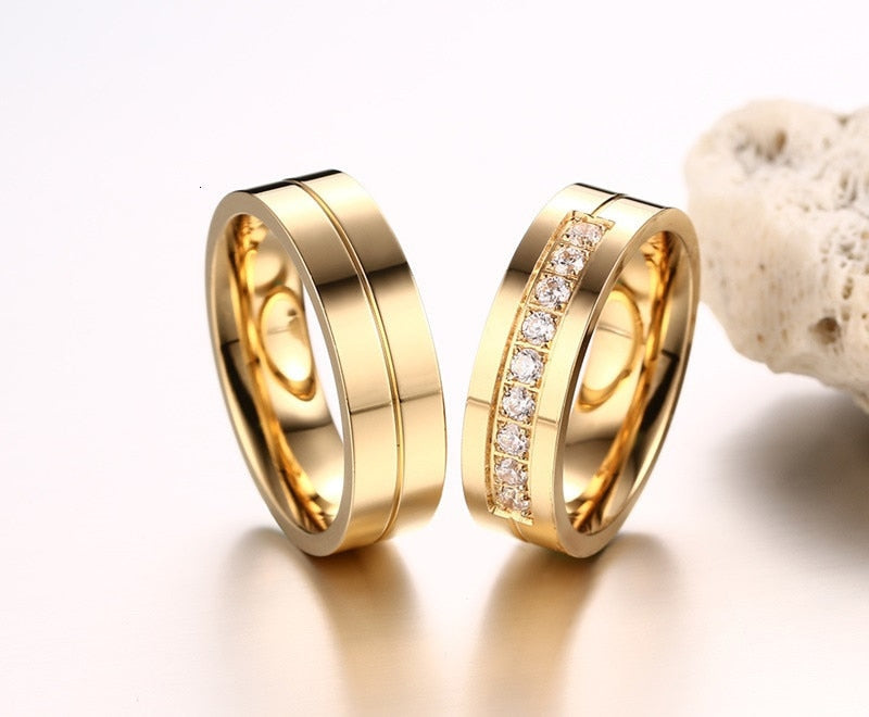 Gold-colored stainless steel wedding band bracelet with CZ stones, designed for women and men, symbolizing love and commitment.