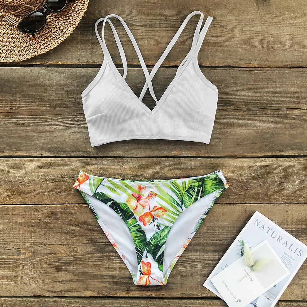 White and green leaf print low-waist bikini set with lace-up detail, two-piece swimsuit for beach and swimming by The Clothing Company Sydney