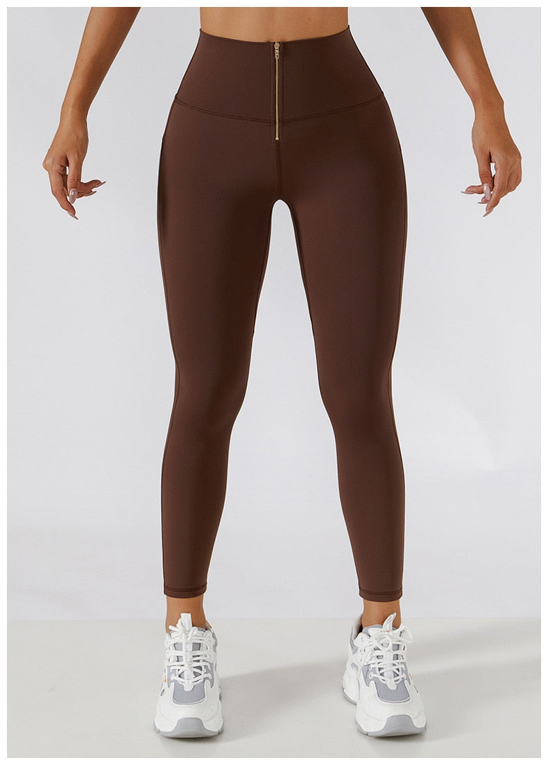 Women's yoga set with high waist leggings, skirt overlay, and zipper sports bra by The Clothing Company Sydney for gym workouts.