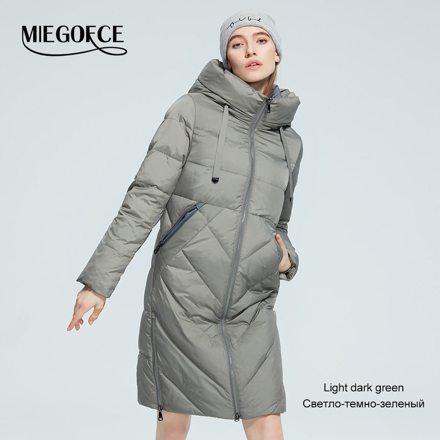 Women’s long cotton winter jacket by The Clothing Company Sydney, with stand collar, hood, zipper, and pockets for warmth and wind protection.
