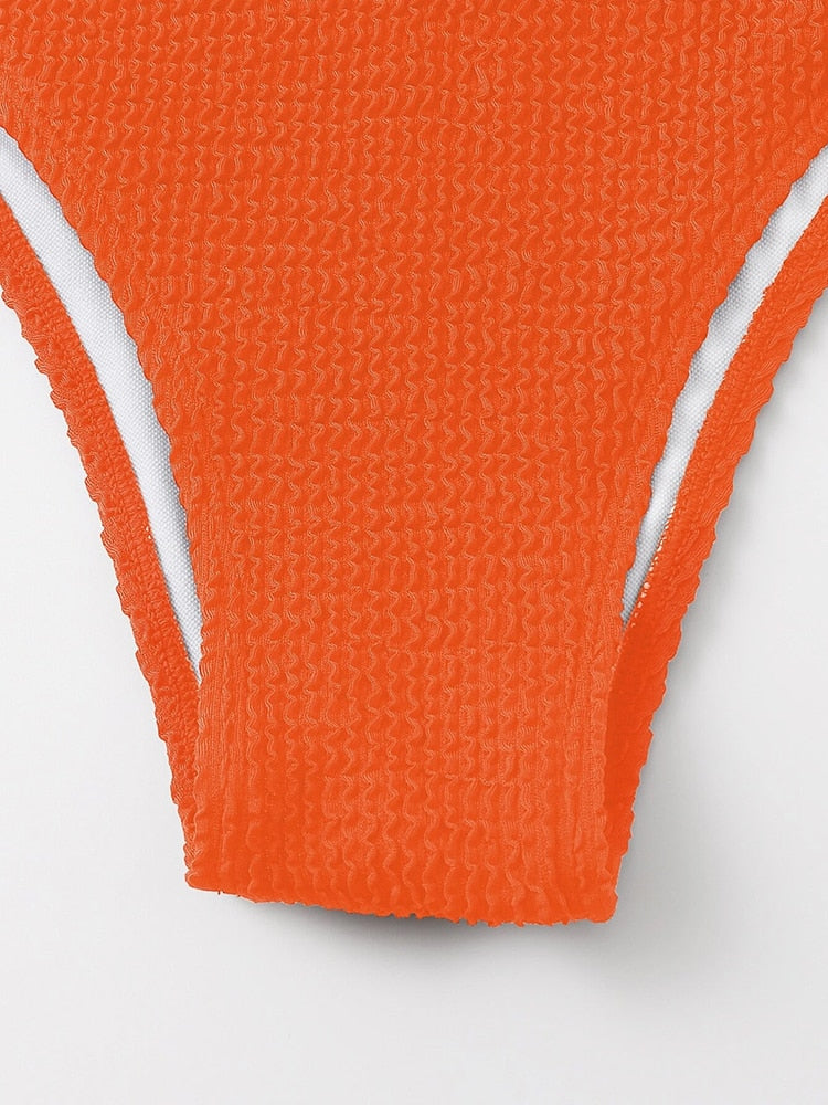 Metal ring textured bikini swimsuit by The Clothing Company Sydney, featuring push-up design, bandage style, and beachwear look.