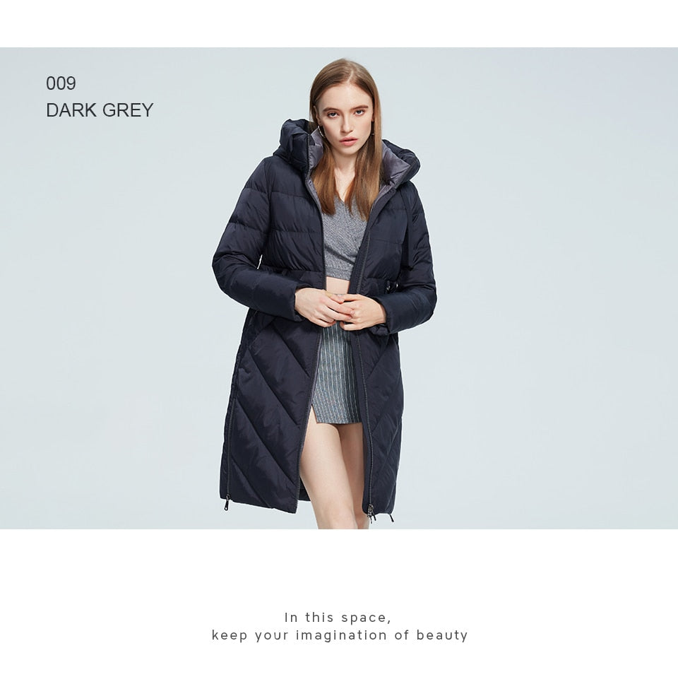 Winter women's long cotton jacket with stand collar, hood, zipper front, and pockets, designed for warmth and windproof protection.