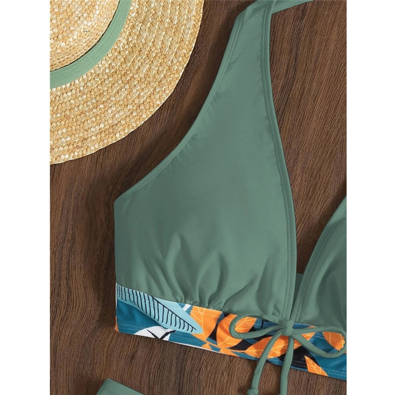 Two-piece bikini swimsuit by The Clothing Company Sydney featuring a lace print, halter neck, high waist, and deep V-neck design.