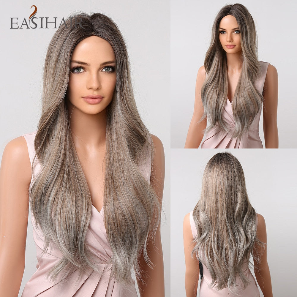 Long wavy synthetic wig with ombre brown, gray, and blonde shades, featuring a middle part, heat-resistant fibers, worn by a woman.