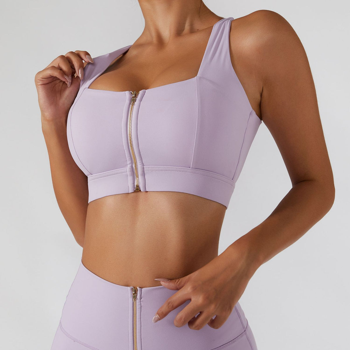 Women's yoga set by The Clothing Company Sydney featuring high waist leggings, a skirt, and a zipper sports bra for fitness workouts.