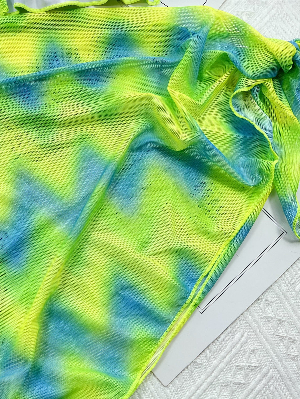 Tie-dye bikini set with skirt, thong style, backless design, lace-up details, from The Clothing Company Sydney, suitable for beachwear.