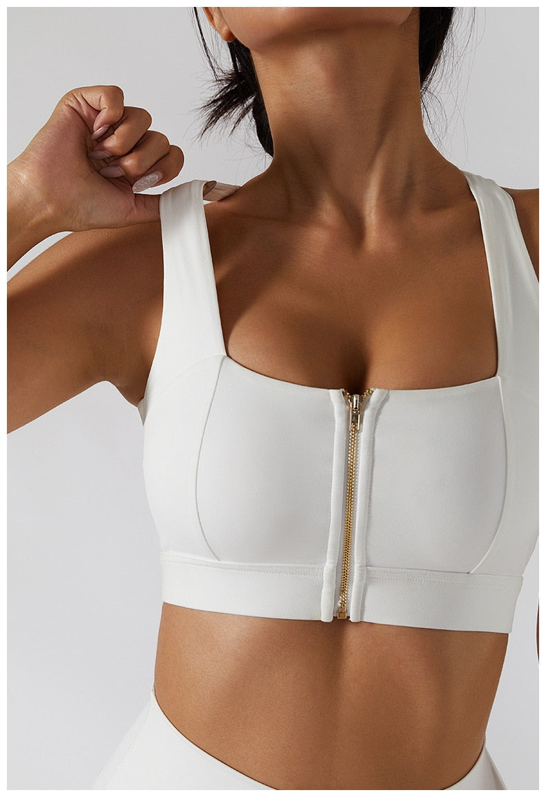 Women's yoga set by The Clothing Company Sydney featuring high waist leggings, a skirt overlay, and a sports bra for gym workouts.