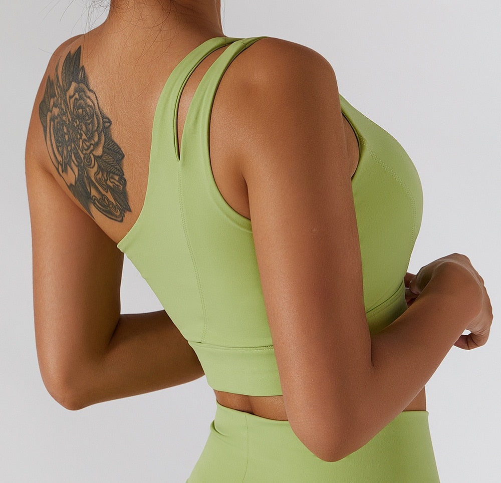 Women's yoga set by The Clothing Company Sydney featuring high waist leggings, a skirt, and a sports bra for gym workouts.