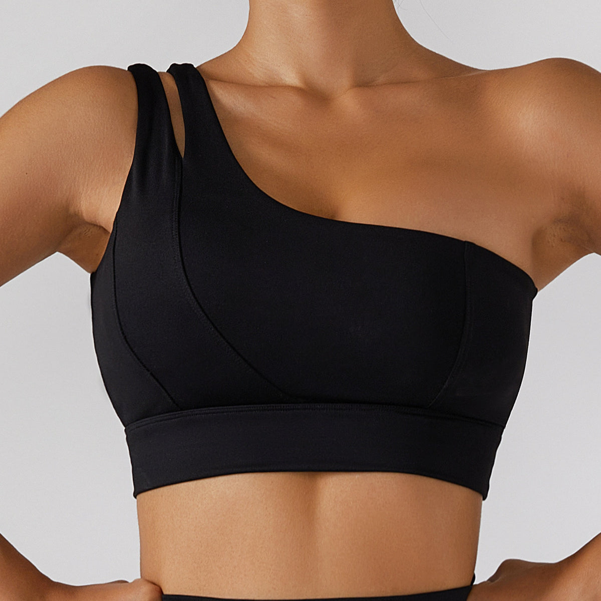 Women's yoga set by The Clothing Company Sydney featuring high waist leggings, a skirt overlay, and a zip sports bra for gym workouts.